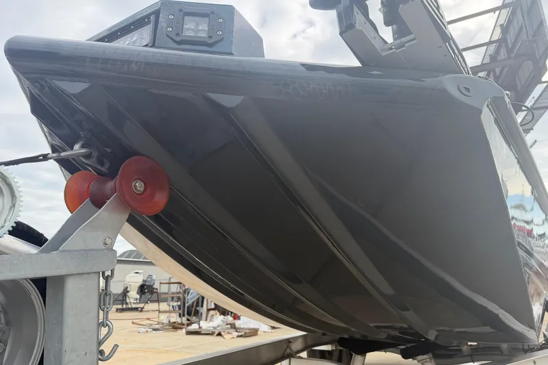 Slide: The Image of 2025 Timber Creek 2064 boat hull on trailer, featuring sleek design and sturdy construction. - 13