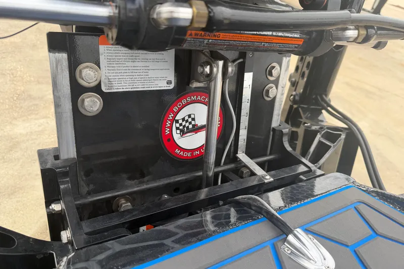 Slide: The Image of Close-up of Timber Creek 2064 machinery, showcasing hydraulic components and branding, 2025 model. - 23