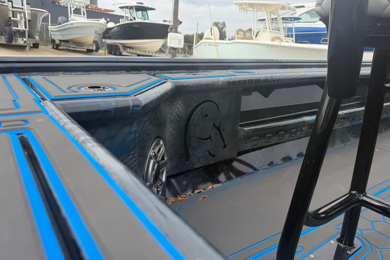 Slide: The Image of Interior view of a 2025 Timber Creek 2064 boat with sleek design and blue accents. - 27