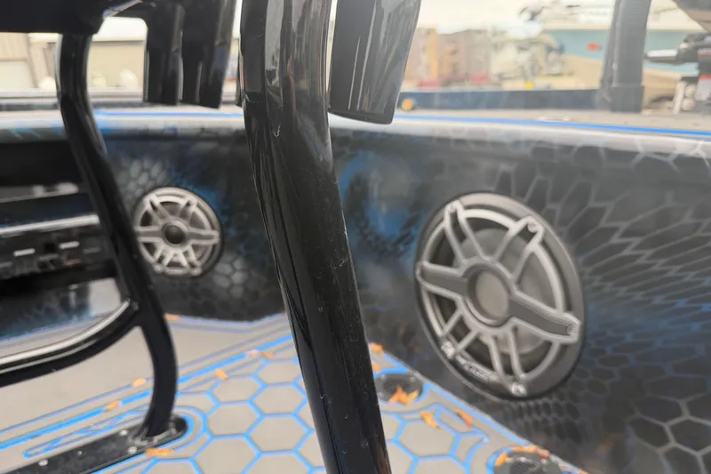 Slide: The Image of 2025 Timber Creek 2064 boat interior with sleek design and modern speaker system. - 7