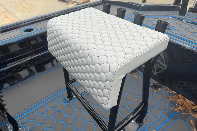Slide: The Image of White hexagonal-patterned seat on a Timber Creek 2064 boat, 2025 model. - 9