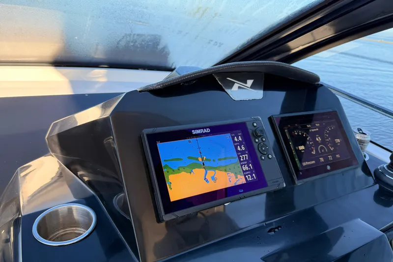 Slide: The Image of Dashboard of 2023 NX Boats 360 Sport Coupe with navigation screens. - 33