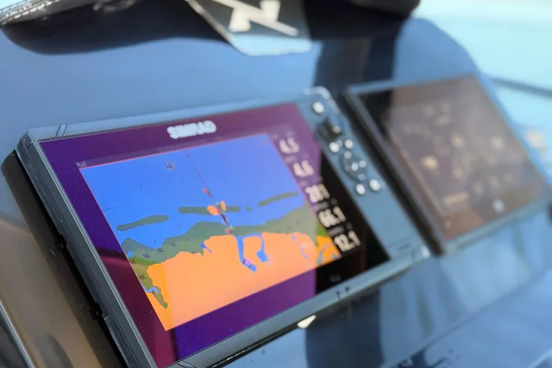 Slide: The Image of Navigation display on 2023 NX Boats 360 Sport Coupe dashboard. - 36