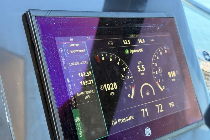 Slide: The Image of Display panel of 2023 NX Boats 360 Sport Coupe showing engine metrics and system status. - 43