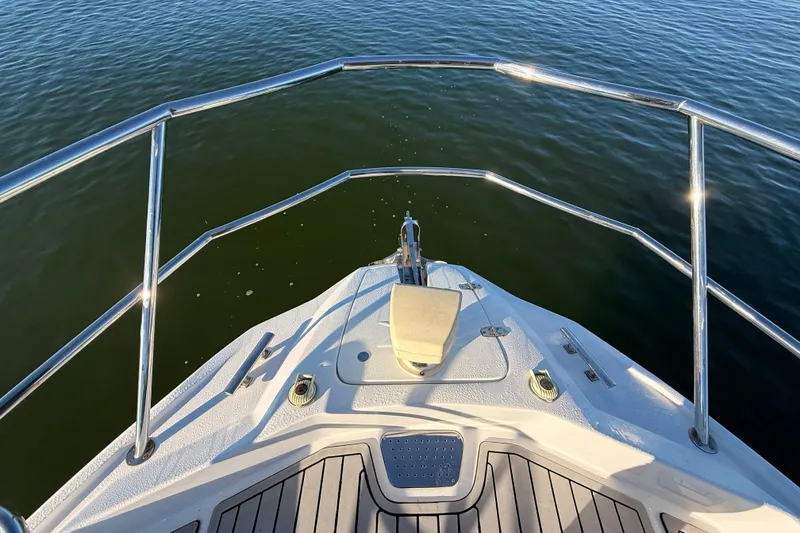 Slide: The Image of Bow view of 2023 NX Boats 360 Sport Coupe on calm water. - 56