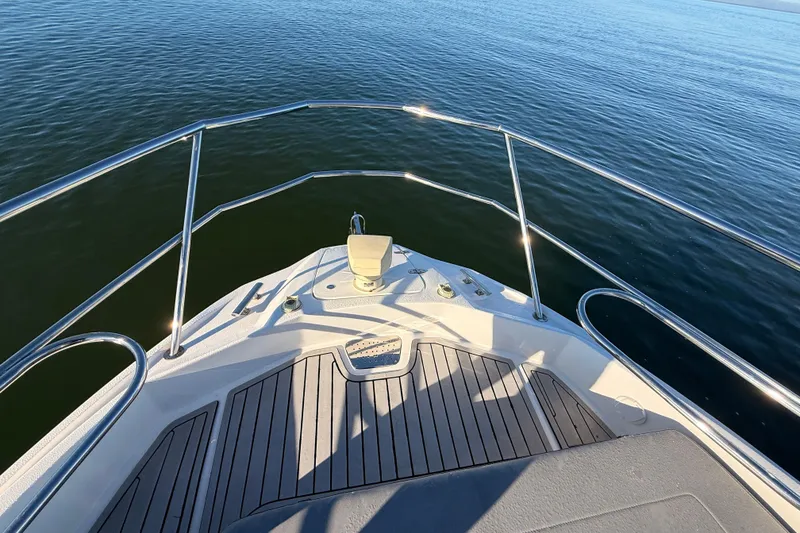 Slide: The Image of Bow view of 2023 NX Boats 360 Sport Coupe on calm water. - 57