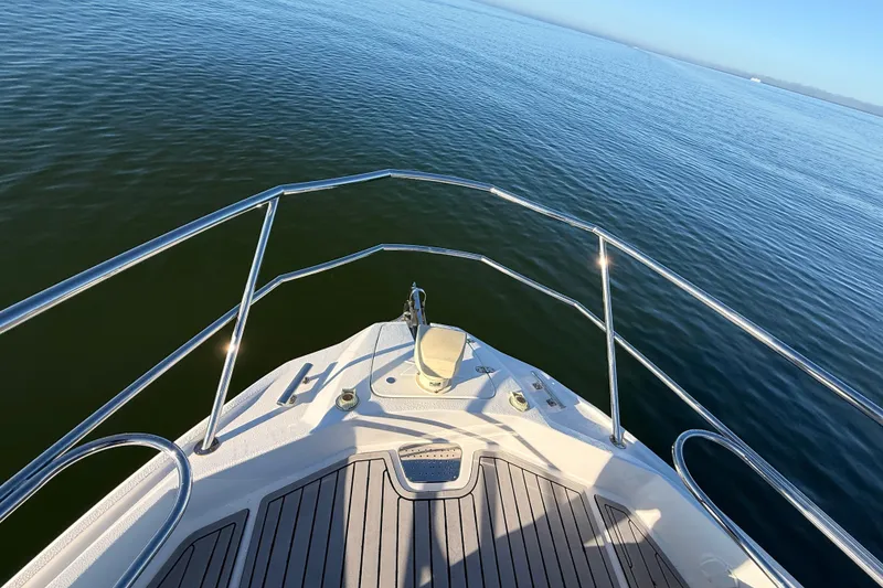 Slide: The Image of Bow view of 2023 NX Boats 360 Sport Coupe on calm water. - 59