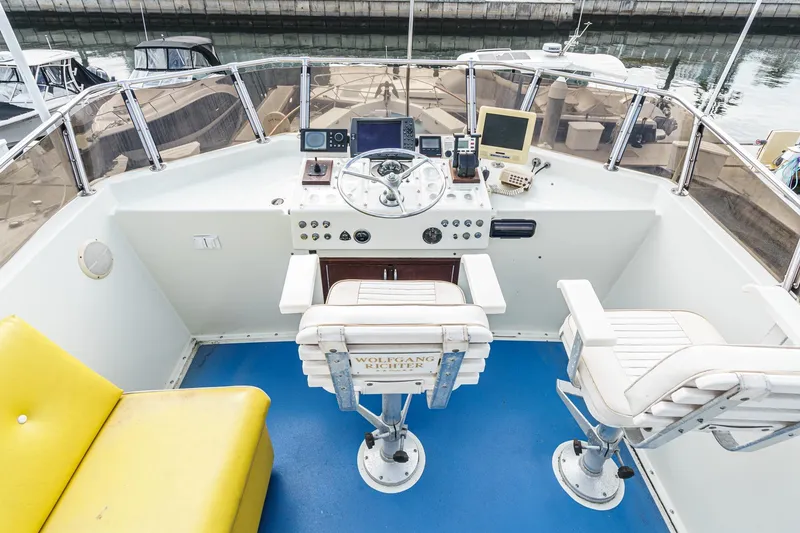 Slide: The Image of Cockpit of 1971 Hatteras 53 Motor Yacht with steering wheel and navigation equipment. - 13
