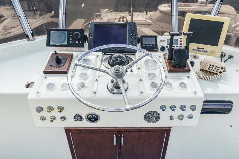 Slide: The Image of Helm of 1971 Hatteras 53 Motor Yacht with navigation instruments and steering wheel. - 14