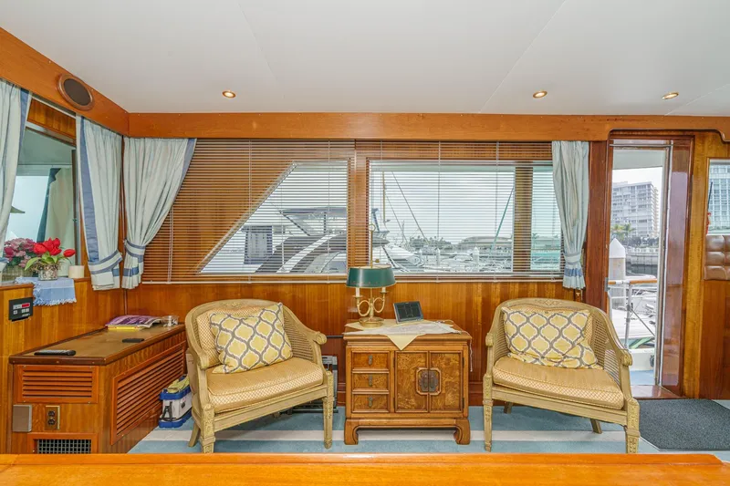 Slide: The Image of Interior of 1971 Hatteras 53 Motor Yacht with elegant seating and wooden decor. - 22