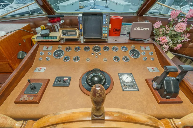 Slide: The Image of 1971 Hatteras 53 Motor Yacht helm with vintage controls and navigation equipment. - 26