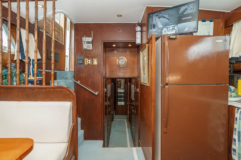 Slide: The Image of Interior of 1971 Hatteras 53 Motor Yacht with wood paneling and appliances. - 37