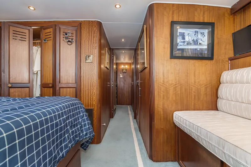 Slide: The Image of Interior of 1971 Hatteras 53 Motor Yacht with wood paneling and cozy seating. - 46