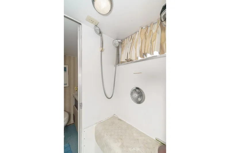 Slide: The Image of Bathroom interior of 1971 Hatteras 53 Motor Yacht with shower and curtain. - 51