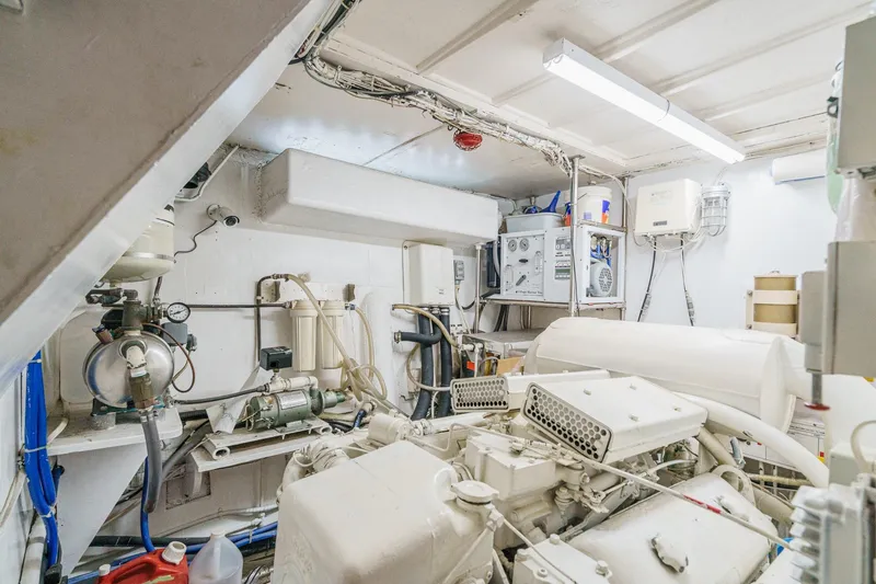 Slide: The Image of Engine room of a 1971 Hatteras 53 Motor Yacht, showcasing mechanical equipment. - 53