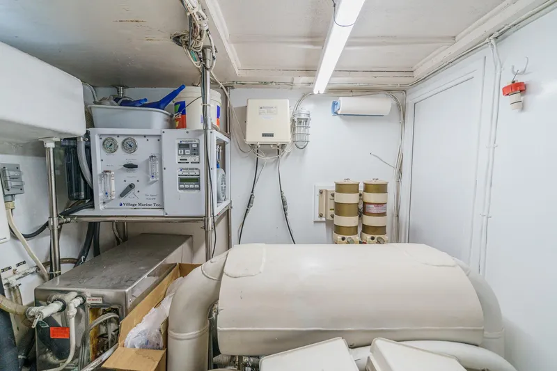 Slide: The Image of Engine room of 1971 Hatteras 53 Motor Yacht with equipment and storage. - 55