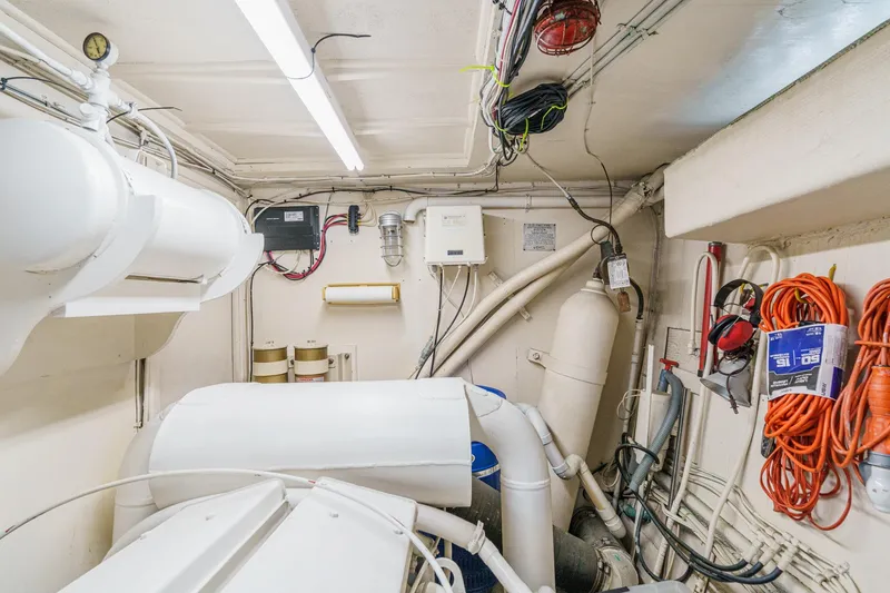 Slide: The Image of Engine room of 1971 Hatteras 53 Motor Yacht with equipment and wiring. - 61