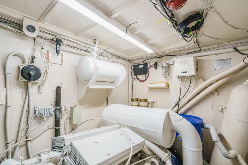 Slide: The Image of Engine room of 1971 Hatteras 53 Motor Yacht with visible wiring and equipment. - 62