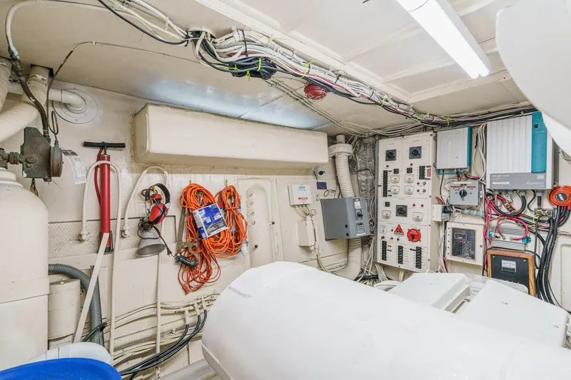 Slide: The Image of Engine room of 1971 Hatteras 53 Motor Yacht with electrical panels and equipment. - 65