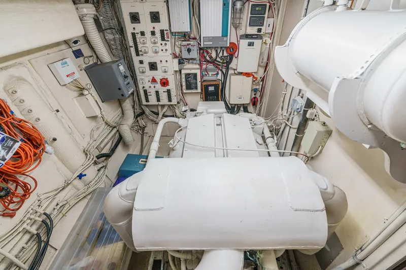 Slide: The Image of Engine room of 1971 Hatteras 53 Motor Yacht with control panels and wiring. - 66