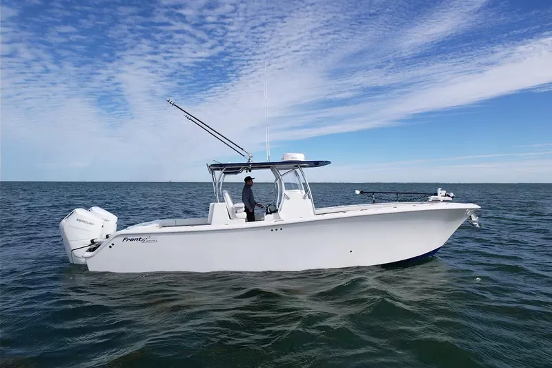 The Image of 2024 Front Runner 33 Center Console boat on open water under blue sky. - 0