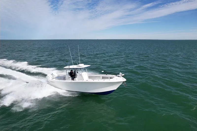 Slide: The Image of 2024 Front Runner 33 Center Console boat cruising on open water. - 10