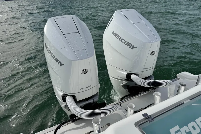 Slide: The Image of Twin Mercury Verado engines on a 2024 Front Runner 33 Center Console boat. - 14