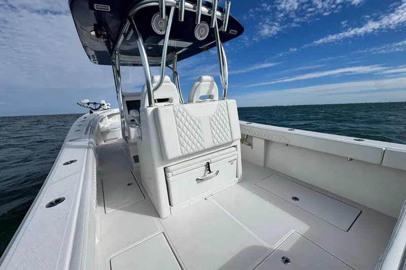 Slide: The Image of 2024 Front Runner 33 Center Console boat on open water, showcasing sleek design and spacious deck. - 18