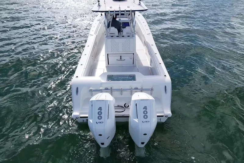 Slide: The Image of 2024 Front Runner 33 Center Console boat with dual 400 V10 engines on water. - 2