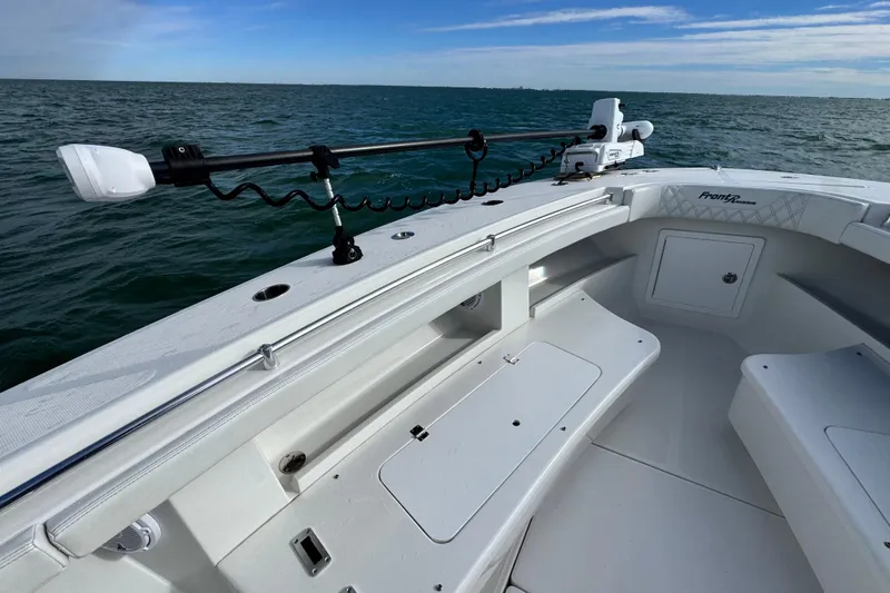 Slide: The Image of 2024 Front Runner 33 Center Console boat on open water, showcasing sleek design. - 24