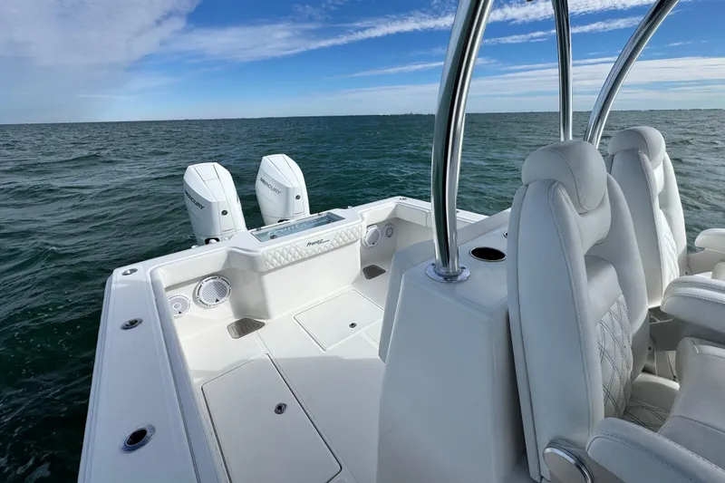 Slide: The Image of 2024 Front Runner 33 Center Console boat on open water, featuring dual Mercury engines. - 29
