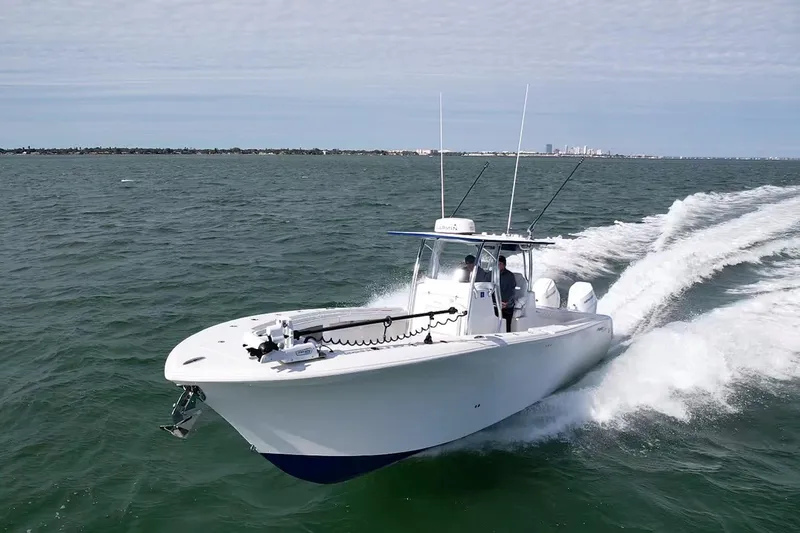 Slide: The Image of 2024 Front Runner 33 Center Console boat cruising on open water. - 9
