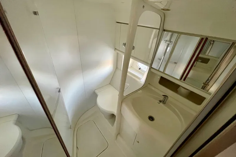 Slide: The Image of Bathroom interior of 2003 Cranchi Atlantique 40 yacht, featuring sink and mirror. - 15