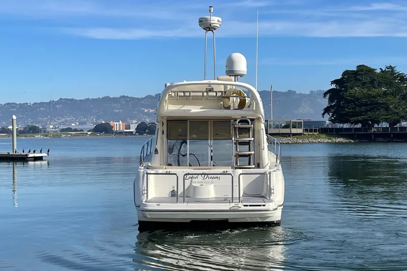 Slide: The Image of 2003 Cranchi Atlantique 40 yacht on calm water with scenic background. - 3