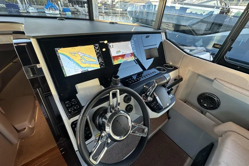 Slide: The Image of 2024 Saxdor 320 GTC helm with advanced navigation displays and controls. - 59
