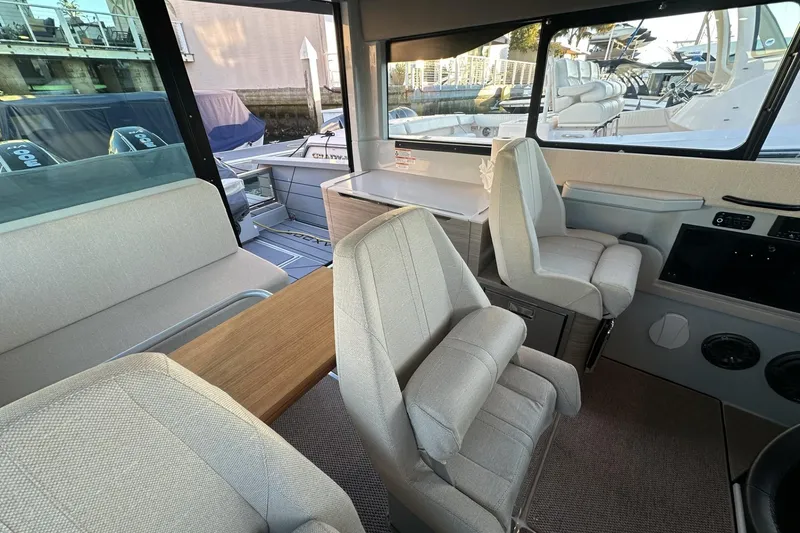 Slide: The Image of Interior of 2024 Saxdor 320 GTC boat with modern seating and table. - 62