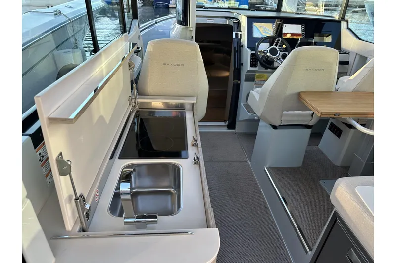 Slide: The Image of 2024 Saxdor 320 GTC interior with modern kitchen and helm station. - 65