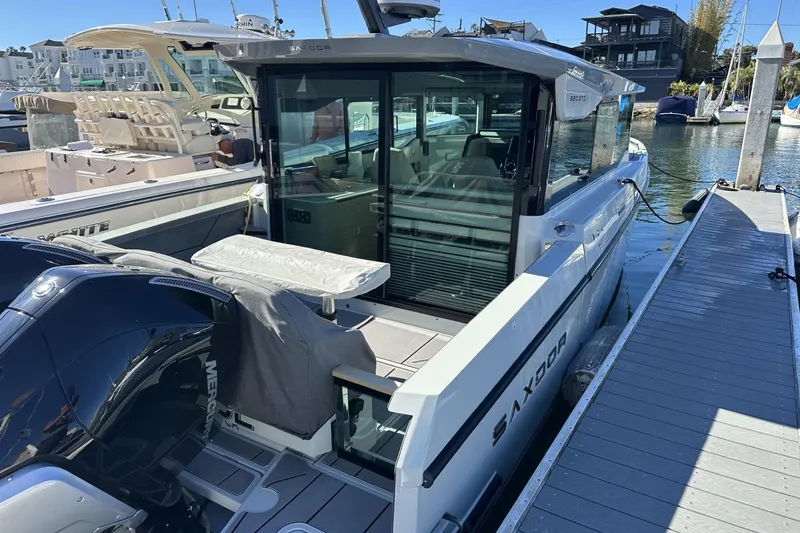 Slide: The Image of 2024 Saxdor 320 GTC boat docked, showcasing sleek design and modern features. - 68