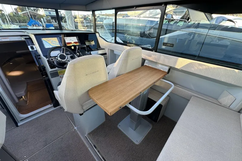 Slide: The Image of Interior of 2024 Saxdor 320 GTC boat with modern helm and seating area. - 70