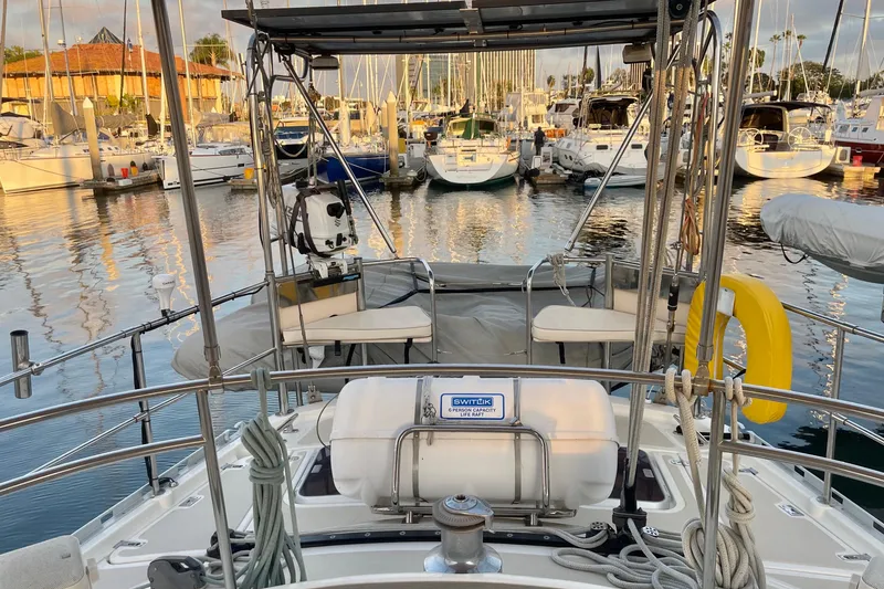 Slide: The Image of 2008 Caliber center cockpit cutter with open hatches at marina dock. - 13