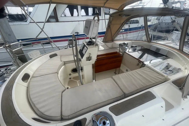 Slide: The Image of Sailboat docked at marina, Caliber center cockpit cutter, 2008 model, under clear sky. - 22