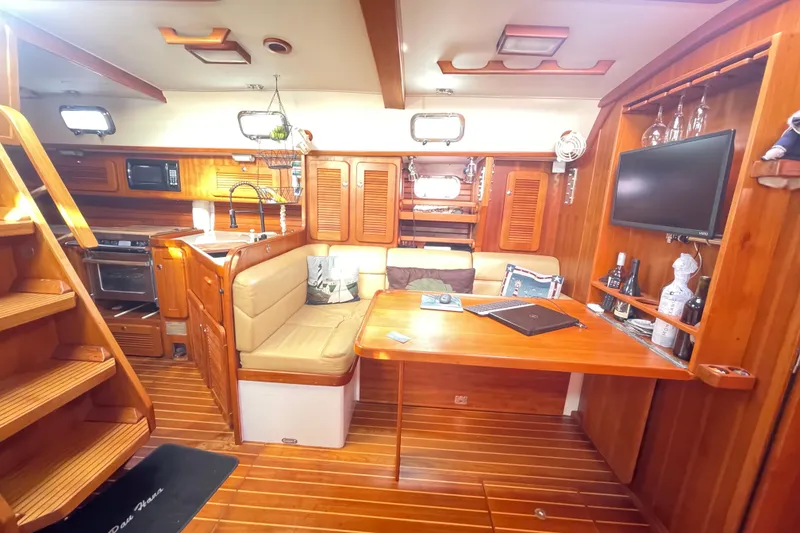 Slide: The Image of Caliber 47 LRC 2008 boat deck with stainless steel ladder and calm water. - 31