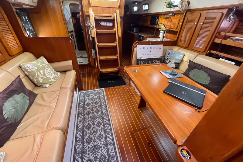 Slide: The Image of 2008 Caliber 47 LRC yacht docked with covered dinghy at Marina del Rey. - 33