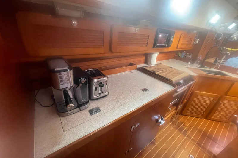 Slide: The Image of Navigation station of 2008 Caliber center cockpit cutter with control panels and seating. - 42