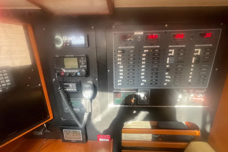 Slide: The Image of 2008 Caliber center cockpit cutter galley with appliances, wooden cabinetry, and countertop. - 48