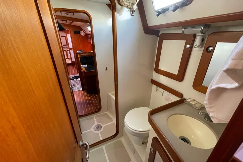 Slide: The Image of Luxurious cabin interior of 2008 Caliber 47 LRC yacht with cozy bedding and wooden finishes. - 51