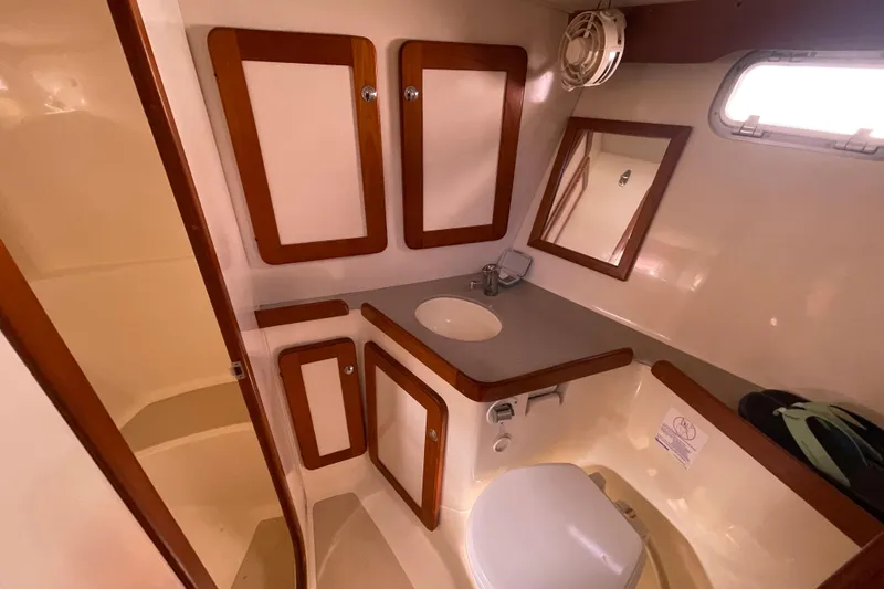 Slide: The Image of Luxurious 2008 Caliber center cockpit cutter cabin with cozy bed and decorative pillows. - 54