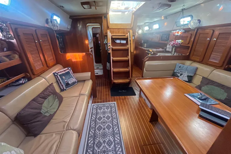 Slide: The Image of Interior of 2008 Caliber 47 LRC yacht with cozy seating and wooden finishes. - 68