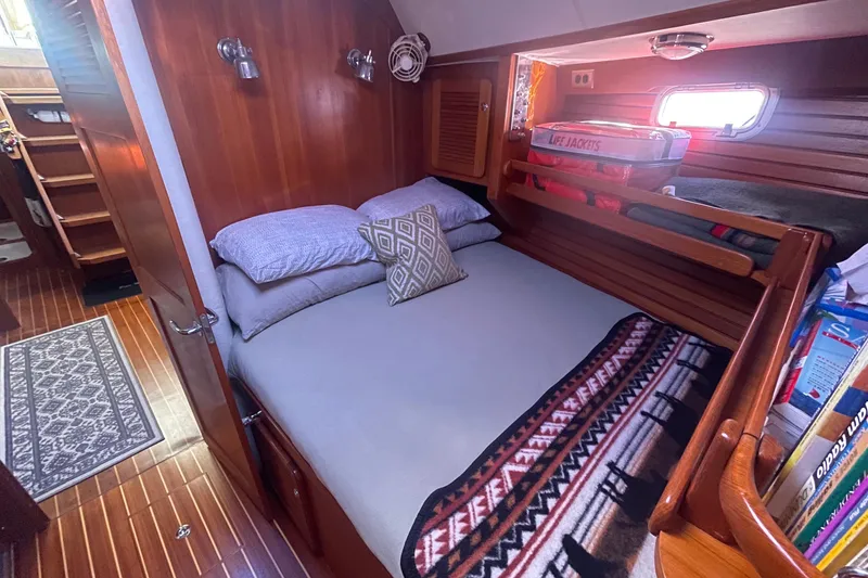 Slide: The Image of Cozy cabin interior of 2008 Caliber 47 LRC yacht with bed and wooden furnishings. - 69