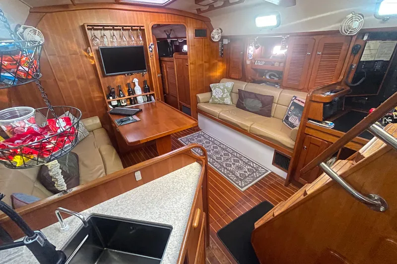 Slide: The Image of Luxurious 2008 Caliber 47 LRC yacht interior with cozy seating, wooden finishes, and modern amenities. - 70